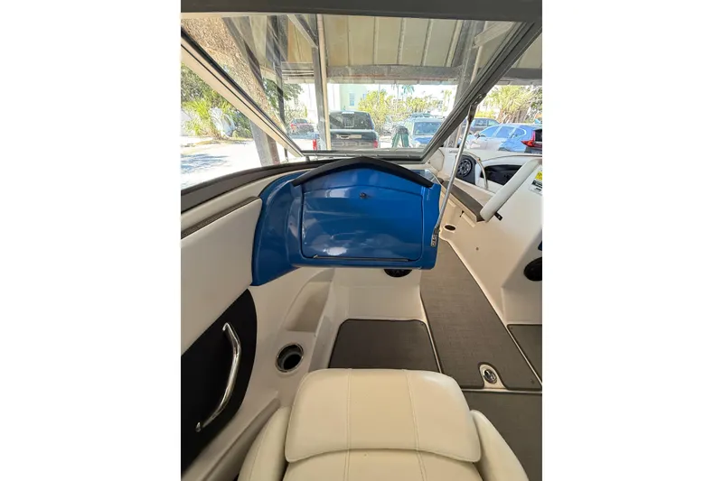 Slide: The Image of Interior view of a 2021 Campion Chase 20 boat, featuring sleek seating and dashboard. - 11
