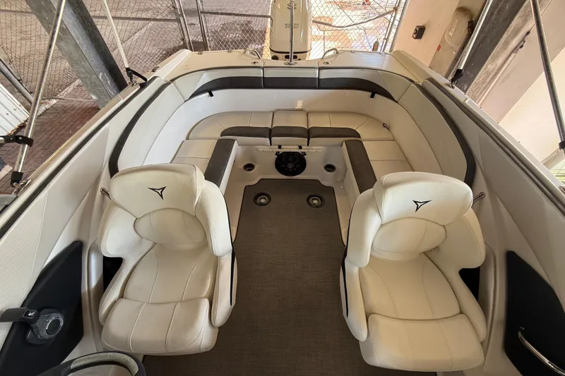 Slide: The Image of Interior of 2021 Campion Chase 20 boat with white leather seating and modern design. - 12