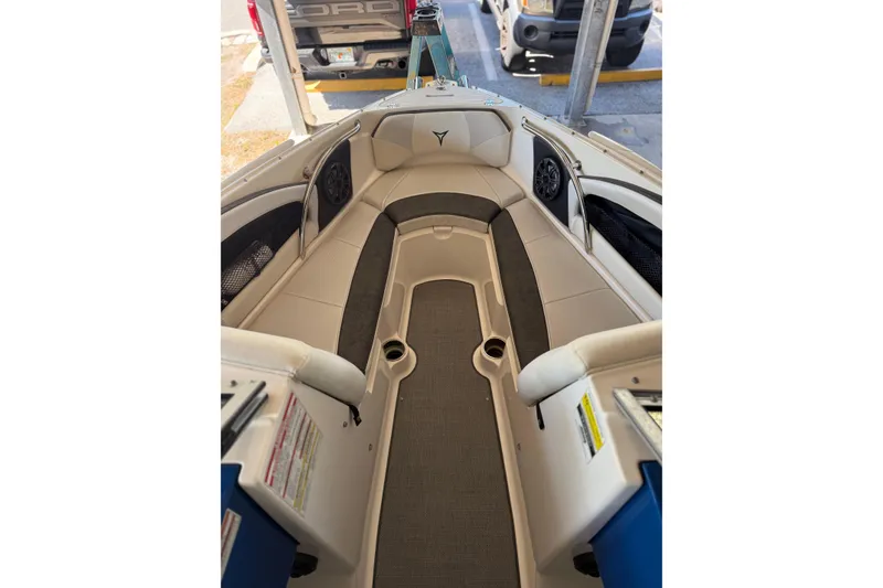 Slide: The Image of Interior view of 2021 Campion Chase 20 boat, featuring cushioned seating and cup holders. - 2
