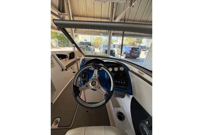 Slide: The Image of Interior view of 2021 Campion Chase 20 boat cockpit with steering wheel and dashboard. - 6