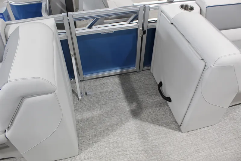 Slide: The Image of 2026 Avalon 2385 25 Venture 85 VRB boat interior with white seating and blue accents. - 4