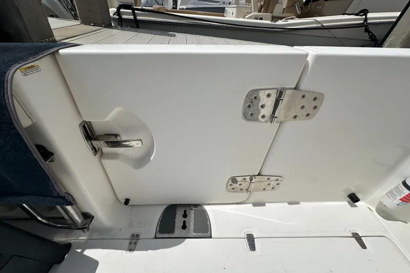 Slide: The Image of 2018 Boston Whaler 350 Outrage boat door with stainless steel hinges and handle. - 30