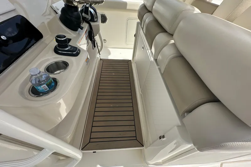 Slide: The Image of Interior of 2018 Boston Whaler 350 Outrage with seating and console details. - 33