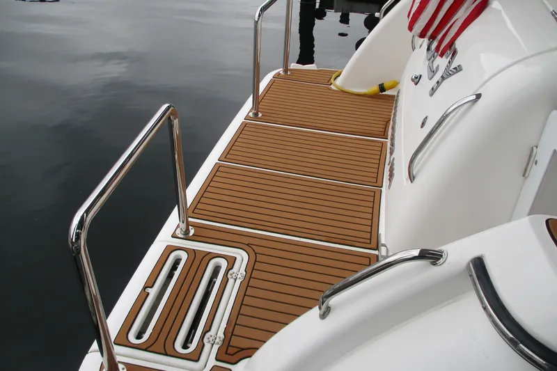 Slide: The Image of 2008 Tiara Yachts 3900 Sovran swim platform with teak decking and stainless steel railings. - 11