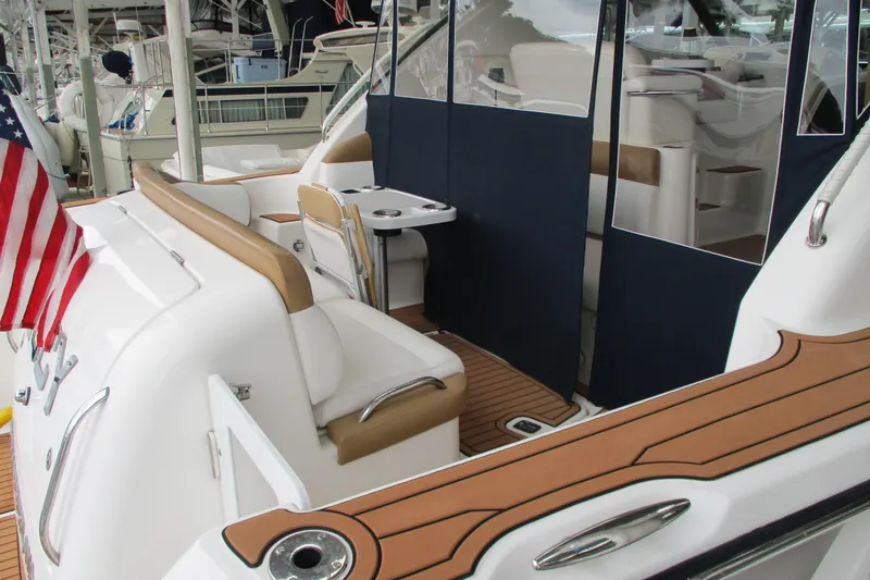 Slide: The Image of 2008 Tiara Yachts 3900 Sovran with elegant seating and American flag on deck. - 15