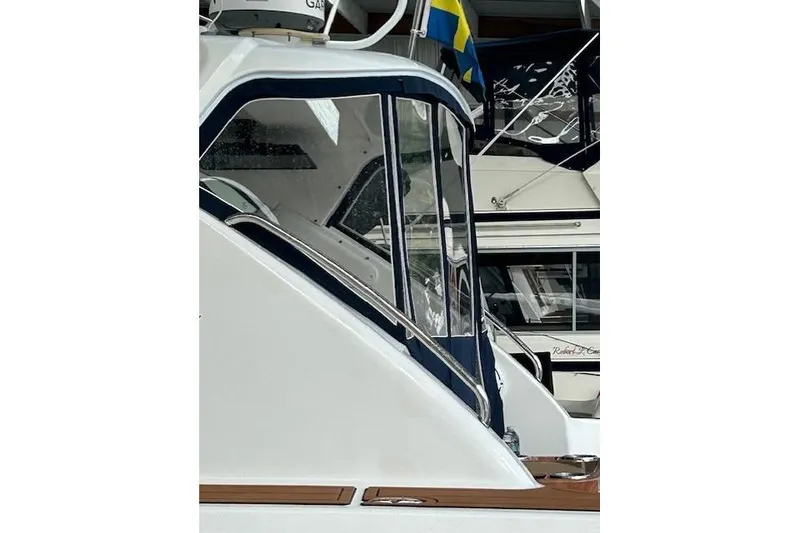 Slide: The Image of 2008 Tiara Yachts 3900 Sovran, side view with sleek design and window details. - 16