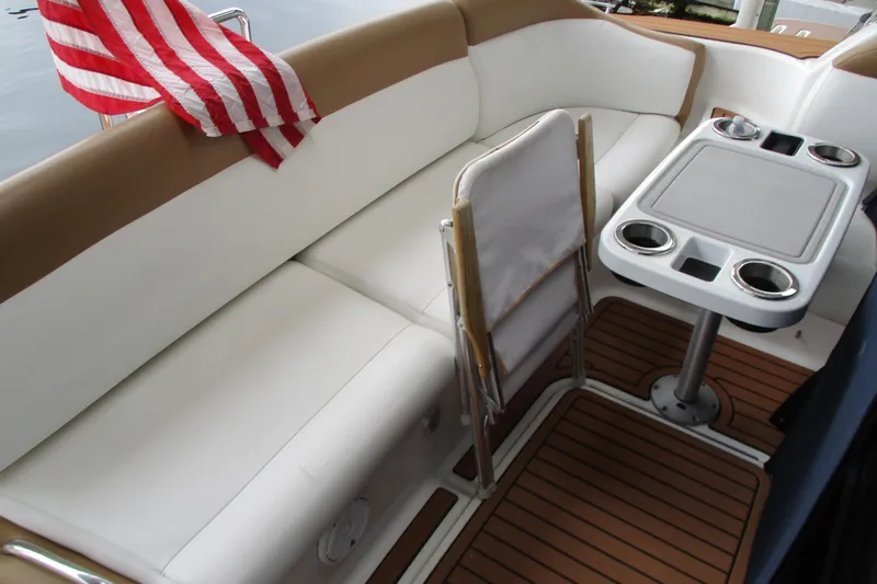 Slide: The Image of 2008 Tiara Yachts 3900 Sovran interior with seating, table, and American flag. - 18