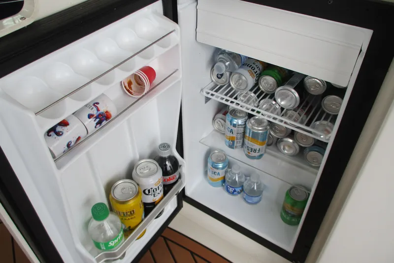 Slide: The Image of Mini fridge stocked with beverages on a 2008 Tiara Yachts 3900 Sovran. - 23