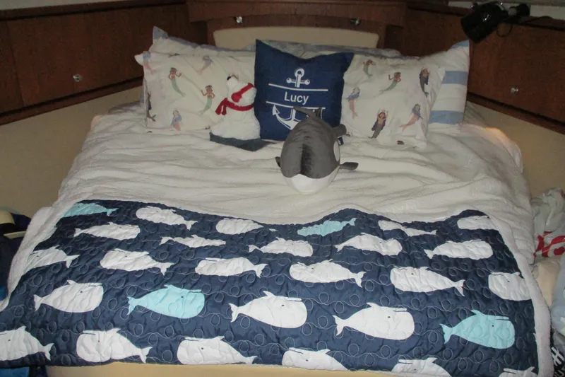 Slide: The Image of Cozy cabin bed in 2008 Tiara Yachts 3900 Sovran with nautical-themed bedding. - 34