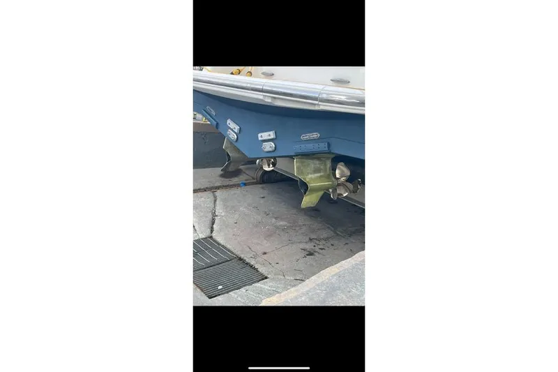 Slide: The Image of 2008 Tiara Yachts 3900 Sovran boat hull and propeller detail in dry dock. - 39