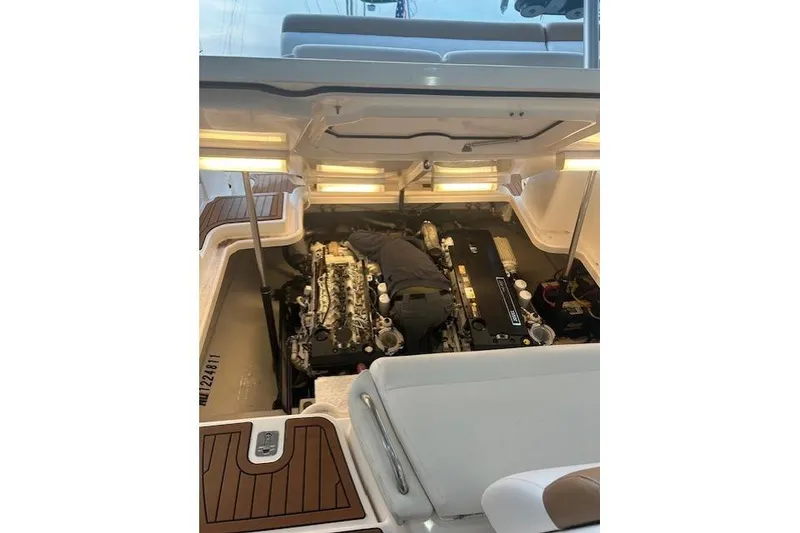 Slide: The Image of Engine compartment of a 2008 Tiara Yachts 3900 Sovran with technician performing maintenance. - 42