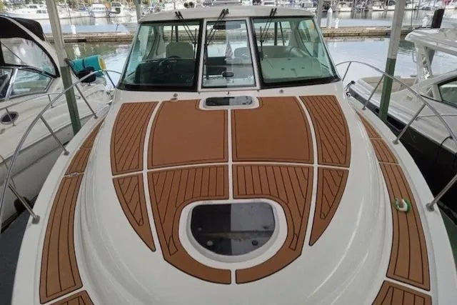 Slide: The Image of 2008 Tiara Yachts 3900 Sovran with teak deck, docked in marina. - 6