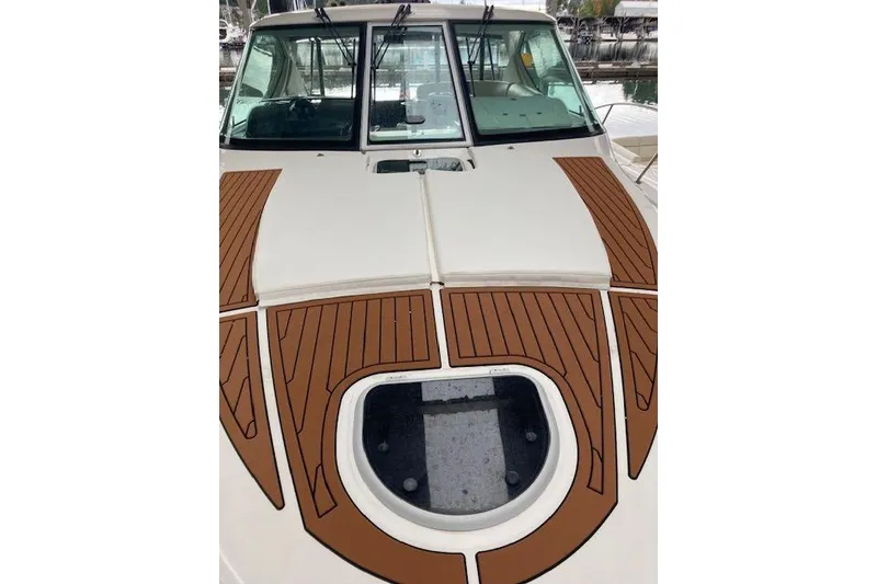 Slide: The Image of 2008 Tiara Yachts 3900 Sovran with teak deck detailing and cabin windows. - 7