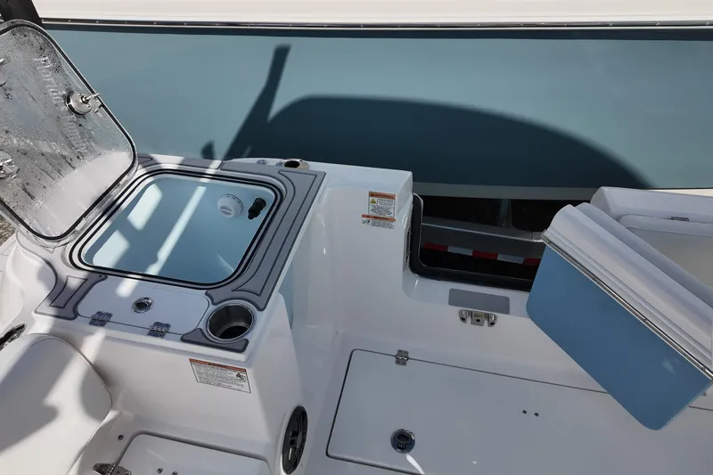 Slide: The Image of 2026 Sea Fox 268 Commander boat interior with open storage compartments and sleek design. - 12