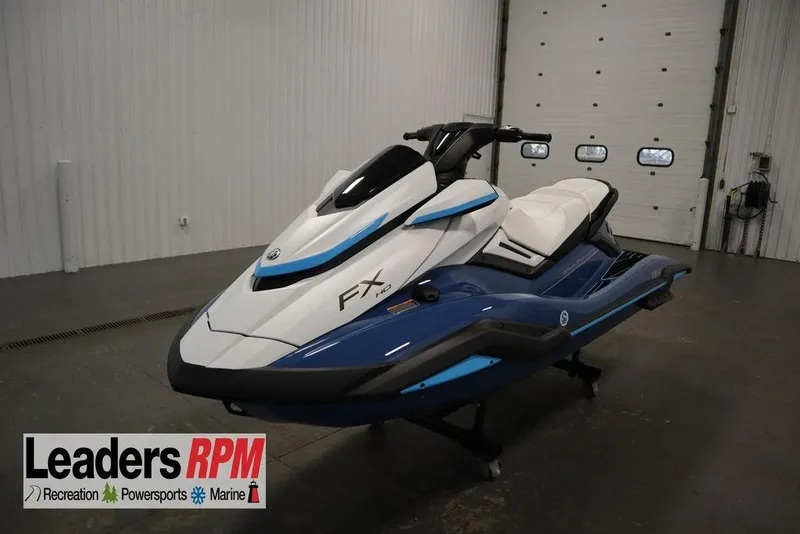 The Image of 2026 Yamaha WaveRunner FX HO in showroom, blue and white design, Leaders RPM logo visible. - 0
