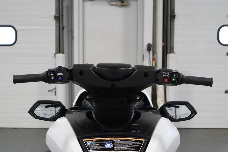 Slide: The Image of 2026 Yamaha WaveRunner FX HO handlebars and controls in a garage setting. - 10