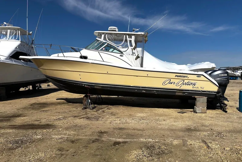 Slide: The Image of 2006 Pursuit 3070 Offshore boat on dry dock, featuring Yamaha engines, in Brick, NJ. - 20