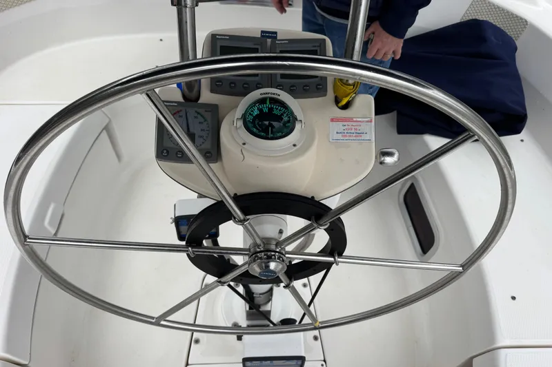 Slide: The Image of Steering wheel and navigation instruments on a 2004 Hunter 386 sailboat. - 19