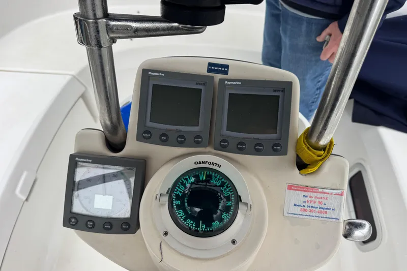 Slide: The Image of Boat cockpit with Raymarine instruments and Danforth compass on a 2004 Hunter 386 sailboat. - 20
