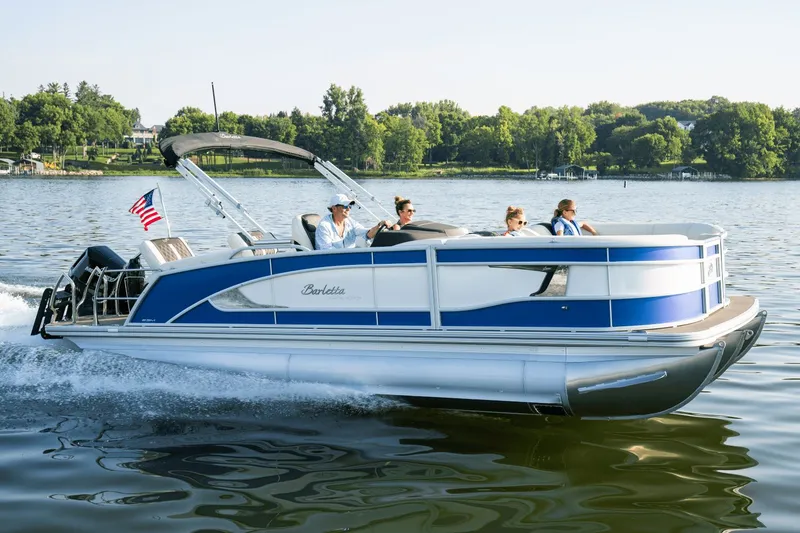 Slide: The Image of Barletta Lusso 23 M 2026 pontoon boat cruising on a serene lake. - 0