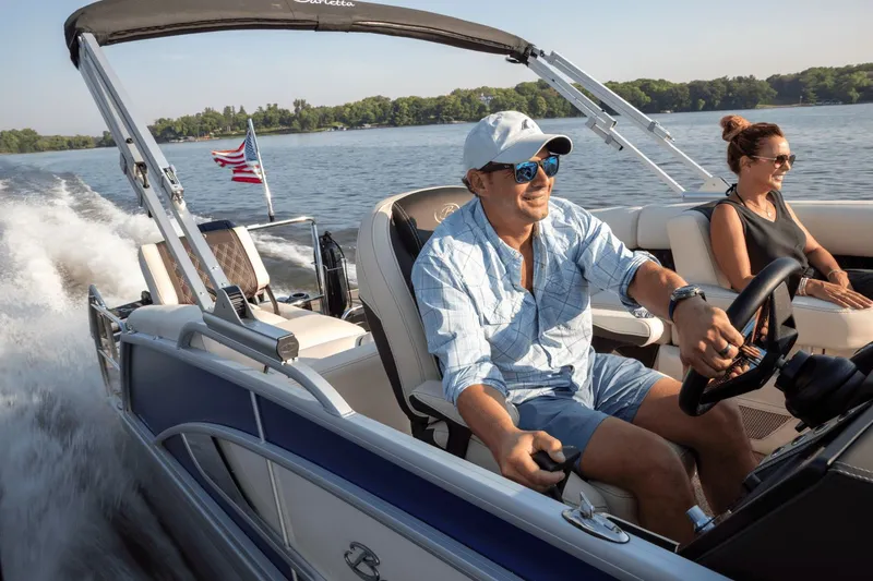 Slide: The Image of Man and woman enjoying 2026 Barletta Lusso 23 M on a lake. - 2