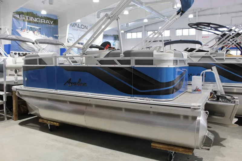 The Image of 2025 Avalon 1575 23 Venture CR pontoon boat displayed indoors. - 1