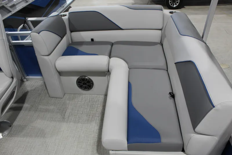 Slide: The Image of 2025 Avalon 1575 23 Venture CR boat interior with gray and blue cushioned seating. - 6