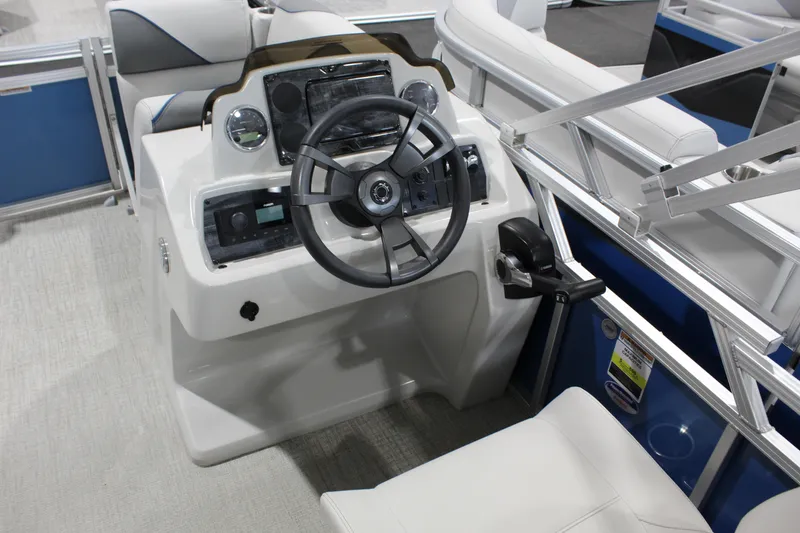 Slide: The Image of 2025 Avalon 1575 23 Venture CR boat cockpit with steering wheel and controls. - 8