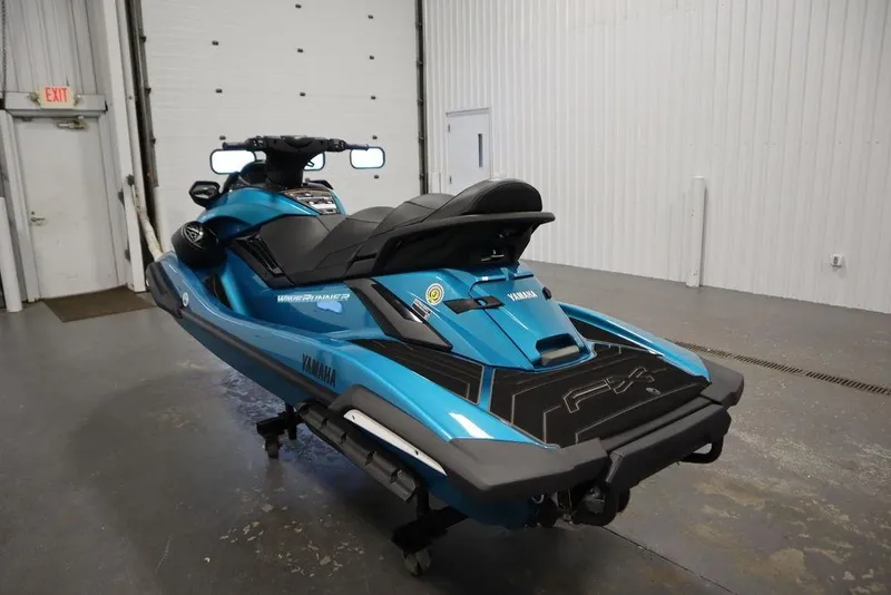 Slide: The Image of 2025 Yamaha WaveRunner FX Cruiser SVHO in a garage setting, showcasing sleek design and vibrant blue color. - 7