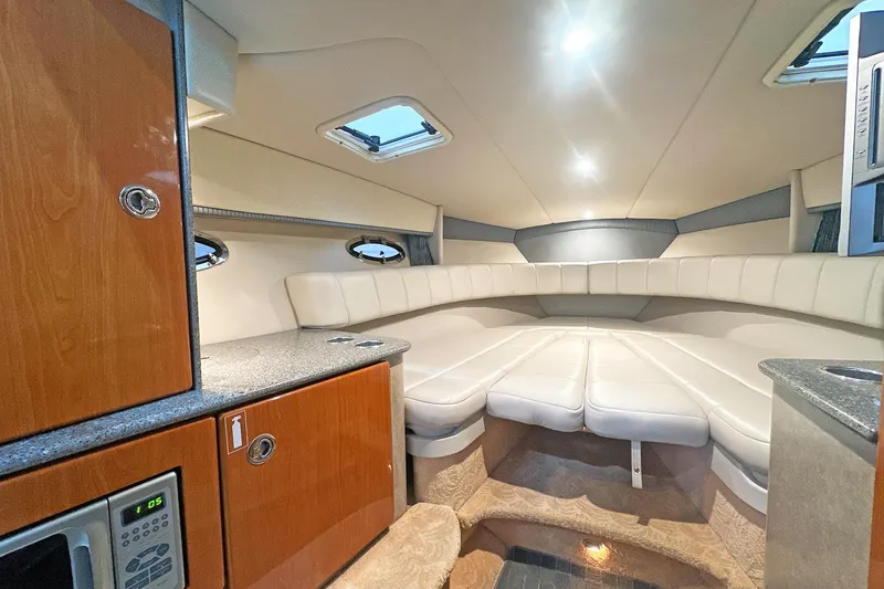 Slide: The Image of Luxurious interior of 2005 Formula 330 Sun Sport boat with plush seating and modern amenities. - 19