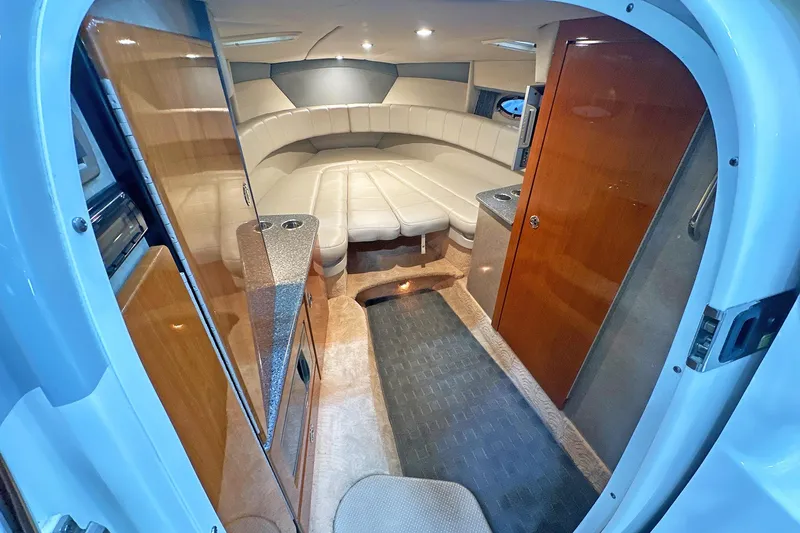Slide: The Image of Interior of 2005 Formula 330 Sun Sport boat with seating and wood finishes. - 20