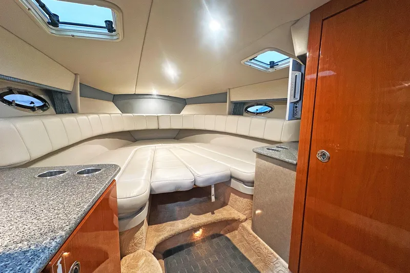Slide: The Image of Luxurious interior of 2005 Formula 330 Sun Sport boat with plush seating and modern amenities. - 22
