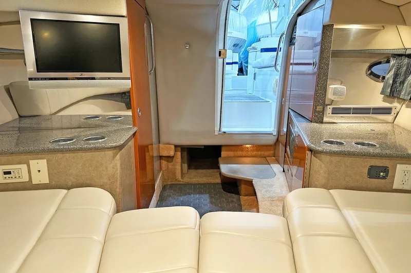 Slide: The Image of Interior of 2005 Formula 330 Sun Sport boat with TV, seating, and kitchenette. - 24