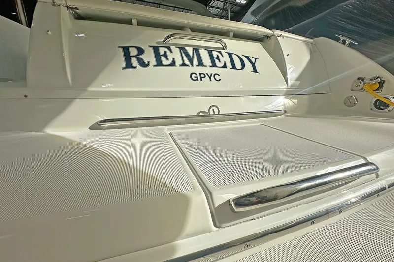 Slide: The Image of 2005 Formula 330 Sun Sport boat with "Remedy" name on the stern. - 5