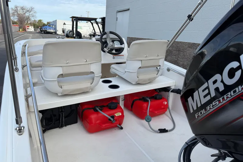 Slide: The Image of 2020 Boston Whaler 130 Super Sport boat interior with Mercury FourStroke engine. - 12
