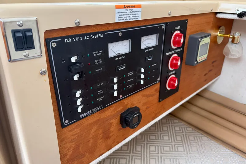Slide: The Image of Control panel of a 2019 Ranger Tugs R-23 boat with 120-volt AC system. - 3