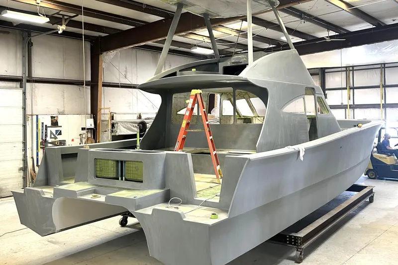 Slide: The Image of 2026 Chris White Spindrift 42 Sportfish under construction in a workshop. - 4