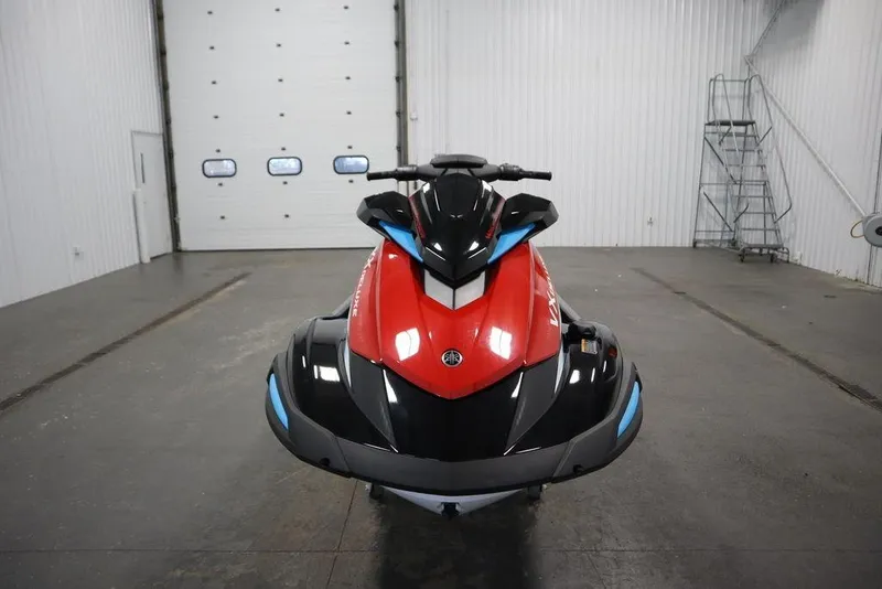 Slide: The Image of 2026 Yamaha WaveRunner VX Deluxe in a garage, front view, red and black design. - 2