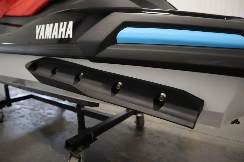 Slide: The Image of 2026 Yamaha WaveRunner VX Deluxe, close-up of side detail in a showroom. - 21