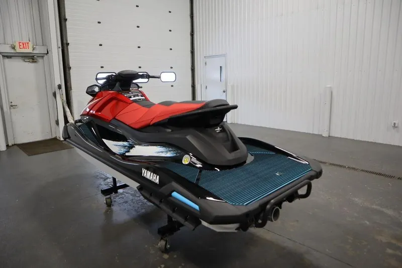 Slide: The Image of 2026 Yamaha WaveRunner VX Deluxe in a showroom, featuring sleek red and black design. - 3