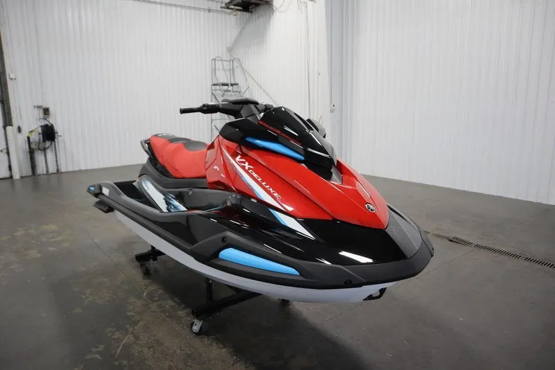Slide: The Image of 2026 Yamaha WaveRunner VX Deluxe in a showroom, featuring sleek red and black design. - 5