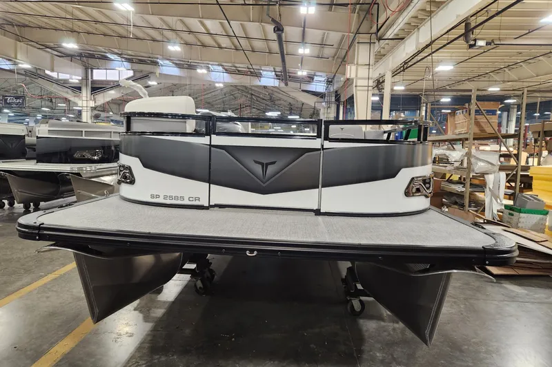 Slide: The Image of 2026 Tahoe Pontoon Sport 85 Cruise 25 in a factory setting, showcasing modern design. - 2