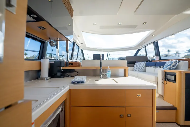 Slide: The Image of Luxurious interior of 2013 Prestige 500S yacht with modern kitchen and seating area. - 13