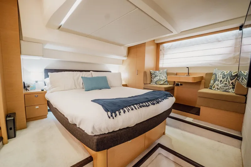Slide: The Image of Luxurious bedroom interior of 2013 Prestige 500S yacht with modern design and cozy furnishings. - 21