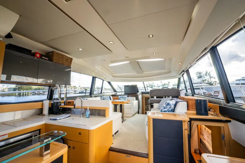 Slide: The Image of Luxurious interior of 2013 Prestige 500S yacht with modern kitchen and seating area. - 29