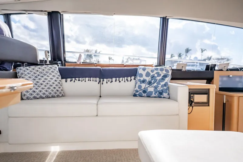 Slide: The Image of Luxurious interior of 2013 Prestige 500S yacht with elegant white sofa and decorative pillows. - 32