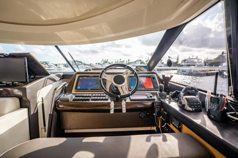 Slide: The Image of Luxurious 2013 Prestige 500S yacht cockpit with advanced navigation systems and waterfront view. - 46
