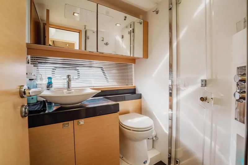 Slide: The Image of Luxurious bathroom interior of 2013 Prestige 500S yacht, featuring modern fixtures and elegant design. - 56