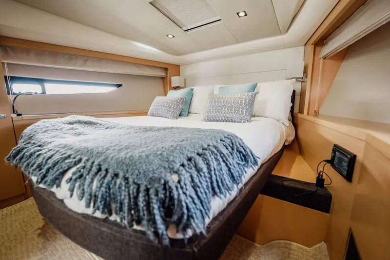 Slide: The Image of Luxurious bedroom interior of 2013 Prestige 500S yacht with cozy bedding. - 62