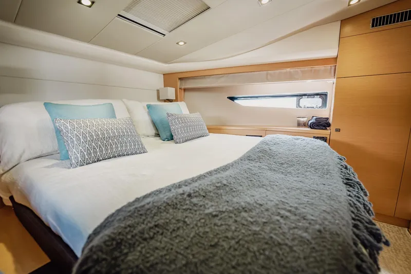 Slide: The Image of Luxurious bedroom interior of 2013 Prestige 500S yacht with elegant bedding and modern design. - 64